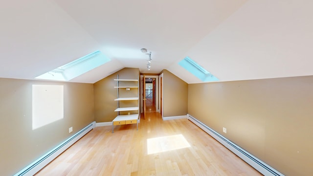 335 Western Ave, Hampden, ME 04444 - bonus room featuring a skylight, a baseboard heating unit, light wood finished floors, lofted ceiling, and baseboards