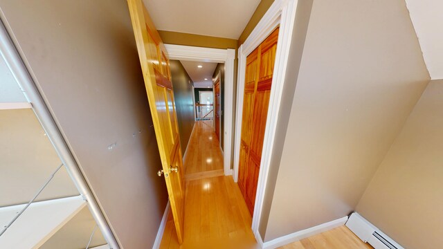 335 Western Ave, Hampden, ME 04444 - corridor with baseboard heating, light wood finished floors, and baseboards