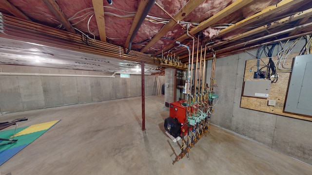 335 Western Ave, Hampden, ME 04444 - unfinished below grade area with electric panel and a heating unit