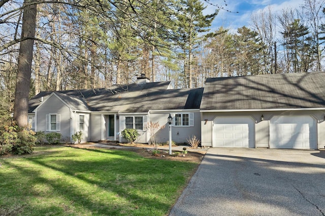 7 Acorn Cir Unit 7, Kennebunk, ME 04043 - dutch colonial with a garage, asphalt driveway, a chimney, a front yard, and a shingled roof