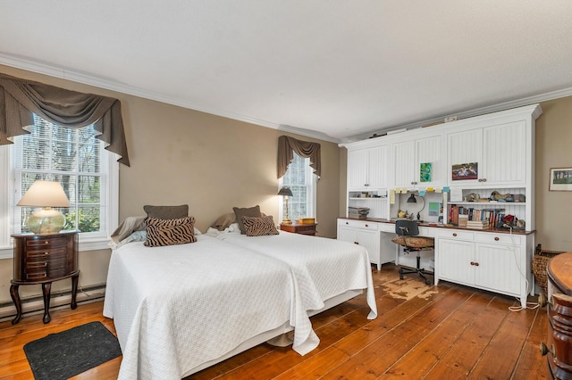 7 Acorn Cir Unit 7, Kennebunk, ME 04043 - bedroom featuring dark wood-type flooring, multiple windows, ornamental molding, and baseboard heating