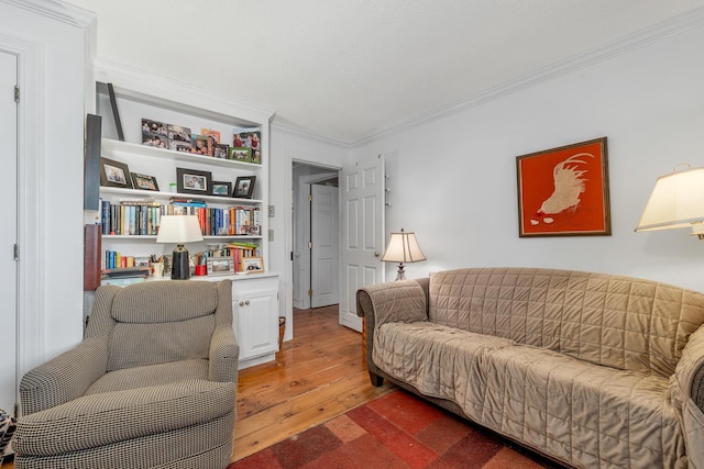 7 Acorn Cir Unit 7, Kennebunk, ME 04043 - living area with ornamental molding, wood-type flooring, and built in features