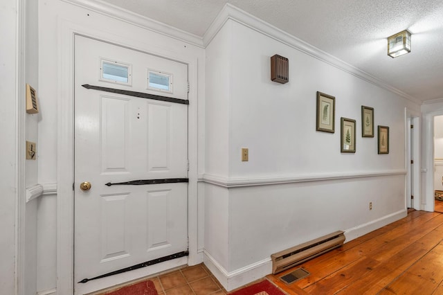 7 Acorn Cir Unit 7, Kennebunk, ME 04043 - foyer entrance with crown molding, baseboards, a textured ceiling, and wood finished floors