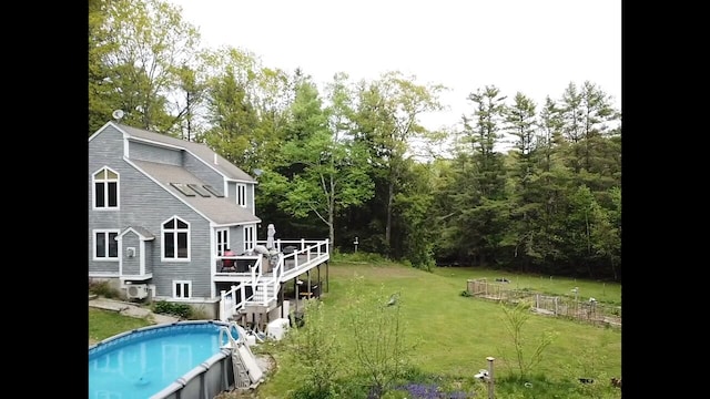 20 Lady Jennifer Dr, Biddeford, ME 04005 - back of house featuring a deck, an outdoor pool, a lawn, and stairs