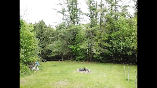 20 Lady Jennifer Dr, Biddeford, ME 04005 - view of grassy yard featuring a fire pit