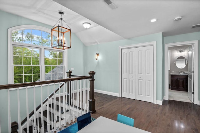 14 Winter Hills Ln, Ogunquit, ME 03907 - hall with an upstairs landing, wood finished floors, baseboards, a chandelier, and lofted ceiling