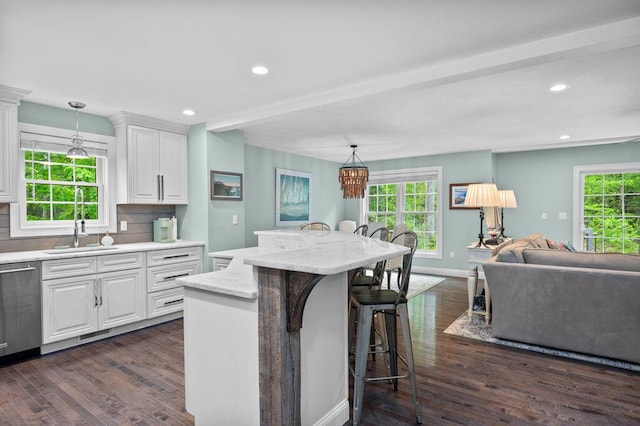 14 Winter Hills Ln, Ogunquit, ME 03907 - kitchen featuring a sink, a chandelier, a kitchen breakfast bar, stainless steel dishwasher, and dark wood finished floors