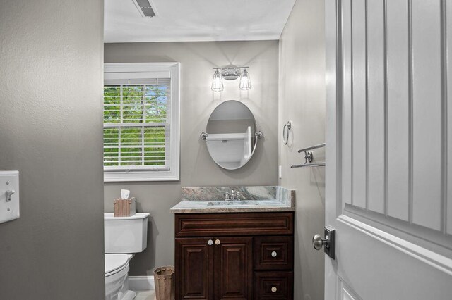 14 Winter Hills Ln, Ogunquit, ME 03907 - half bathroom with toilet, vanity, and baseboards
