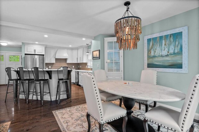 14 Winter Hills Ln, Ogunquit, ME 03907 - dining area with dark wood-style flooring, a chandelier, recessed lighting, and baseboards