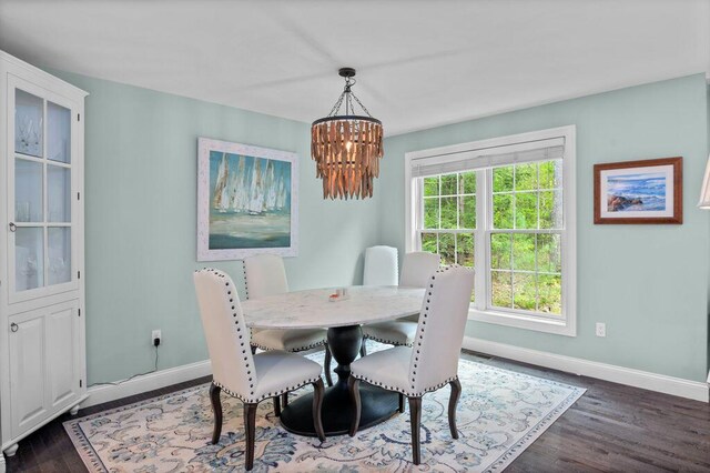 14 Winter Hills Ln, Ogunquit, ME 03907 - dining space with baseboards, a chandelier, and wood finished floors