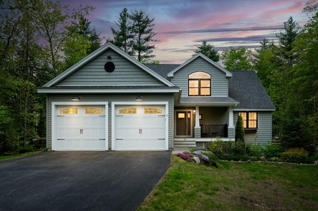 14 Winter Hills Ln, Ogunquit, ME 03907 - view of front of home featuring a porch, driveway, an attached garage, a shingled roof, and a yard