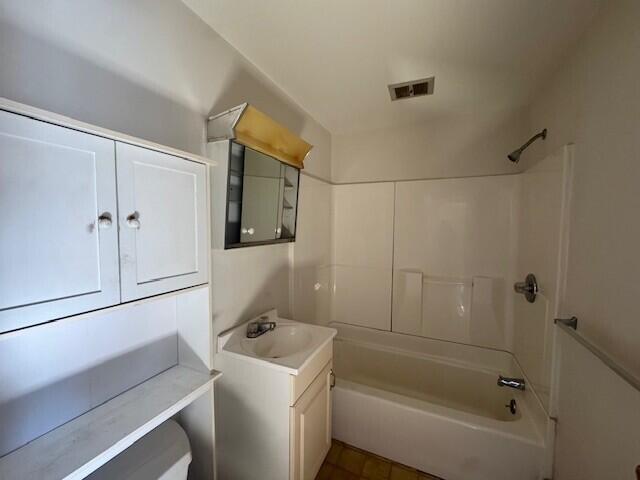 8 Sunset View St Unit 2, Gray, ME 04039 - bathroom featuring vanity, tub / shower combination, and toilet