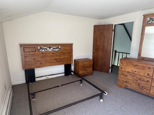 8 Sunset View St Unit 2, Gray, ME 04039 - bedroom with a baseboard radiator, carpet floors, and vaulted ceiling