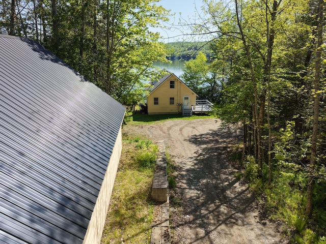 1809 Embden Pond Rd, Embden, ME 04958 - view of side of property featuring metal roof and driveway