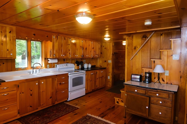 1809 Embden Pond Rd, Embden, ME 04958 - kitchen with white electric stove, a sink, brown cabinetry, wood ceiling, and dark wood finished floors
