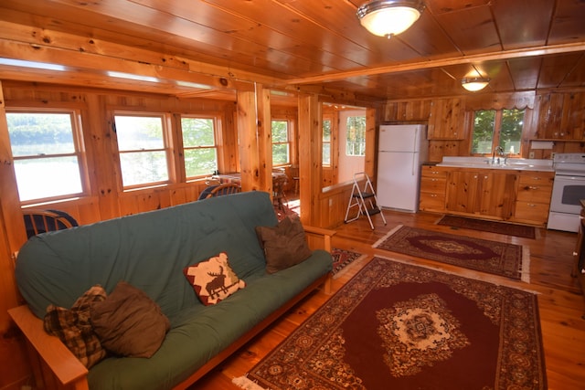 1809 Embden Pond Rd, Embden, ME 04958 - living area featuring wooden walls, wooden ceiling, and wood finished floors