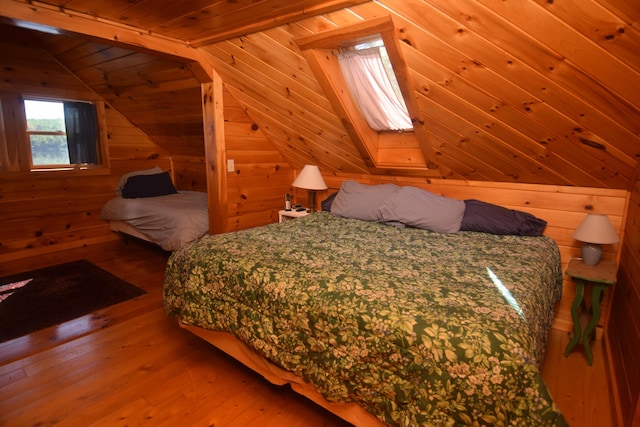 1809 Embden Pond Rd, Embden, ME 04958 - bedroom featuring wood-type flooring, lofted ceiling, wood walls, and wooden ceiling
