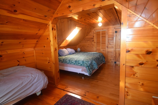 1809 Embden Pond Rd, Embden, ME 04958 - bedroom with wood ceiling, wooden walls, hardwood / wood-style flooring, and lofted ceiling