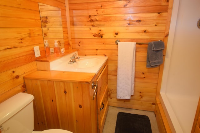 1809 Embden Pond Rd, Embden, ME 04958 - bathroom with vanity, toilet, and wooden walls