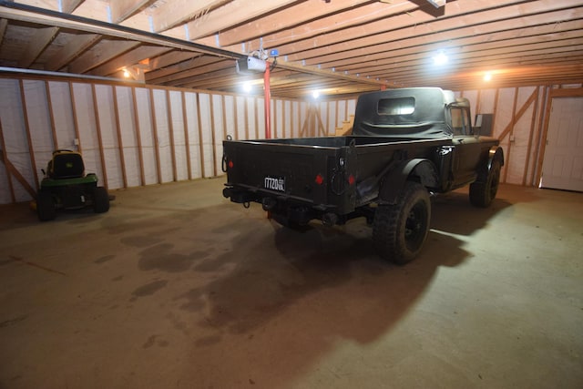 1809 Embden Pond Rd, Embden, ME 04958 - garage featuring a garage door opener