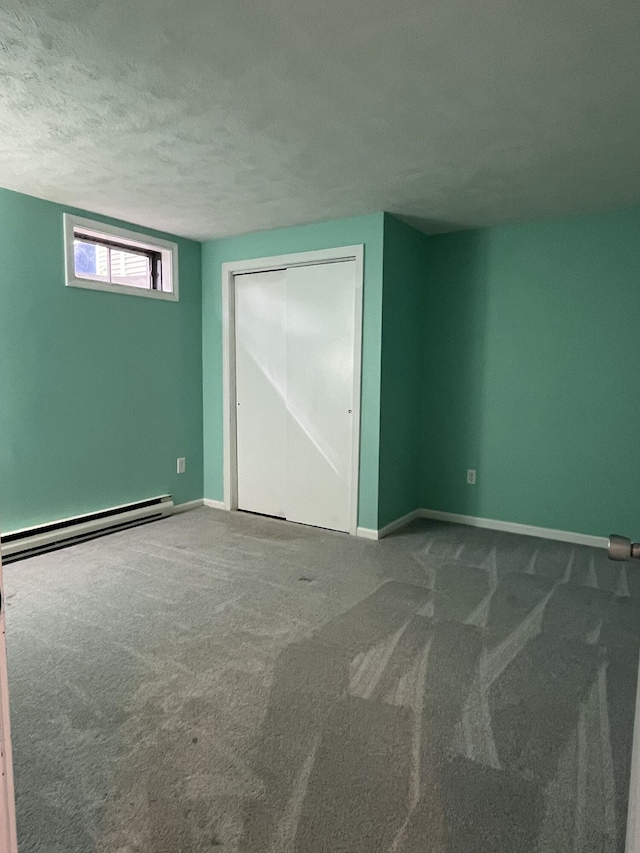 39 Thompson St, Wells, ME 04090 - carpeted spare room with baseboard heating and a textured ceiling