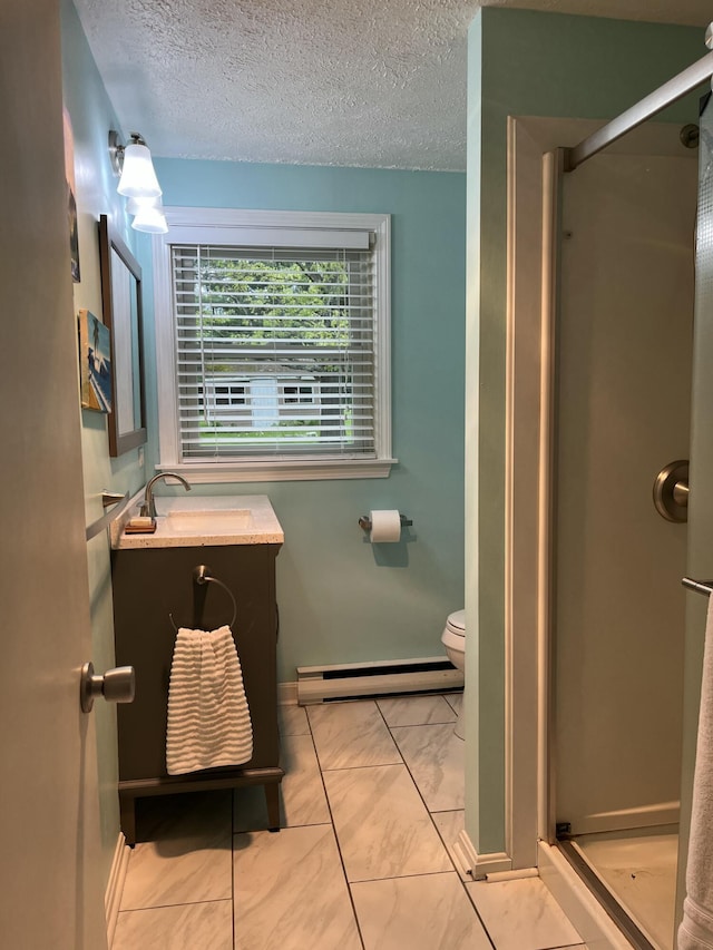 39 Thompson St, Wells, ME 04090 - full bath with baseboard heating, a shower stall, vanity, and a textured ceiling