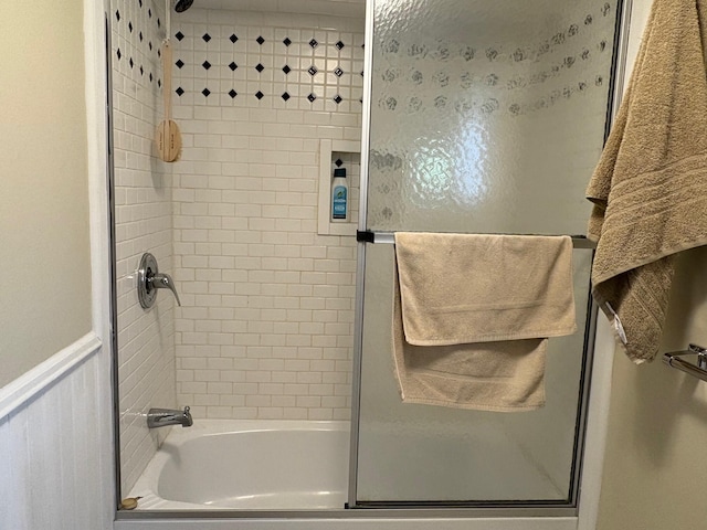 1236 Waldo Station Rd, Waldo, ME 04915 - bathroom with shower / bath combination with glass door and a wainscoted wall