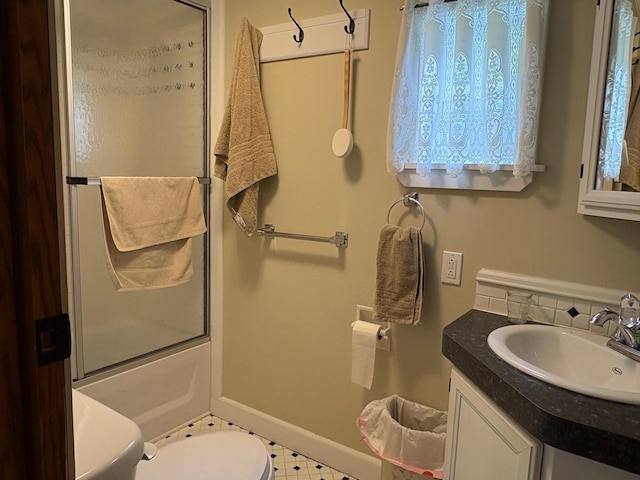 1236 Waldo Station Rd, Waldo, ME 04915 - full bath with toilet, vanity, bath / shower combo with glass door, and baseboards