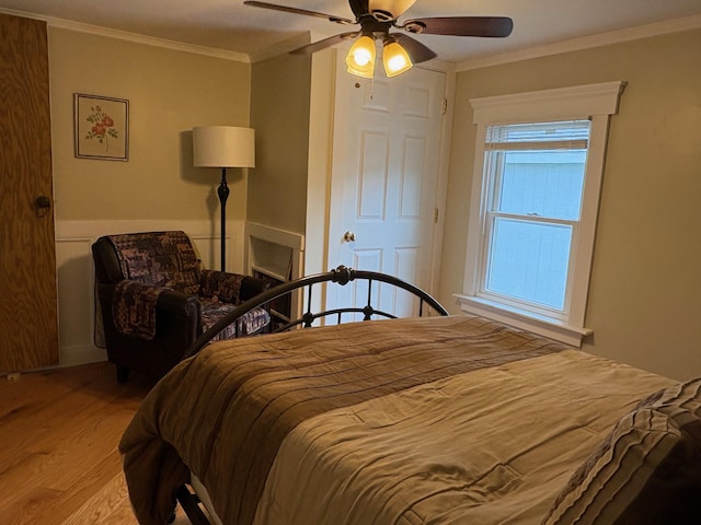 1236 Waldo Station Rd, Waldo, ME 04915 - bedroom with wood finished floors, crown molding, and a ceiling fan