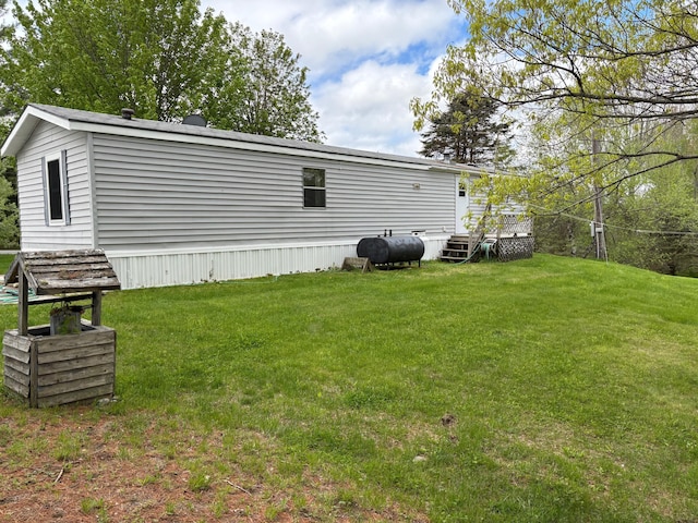 1236 Waldo Station Rd, Waldo, ME 04915 - back of house featuring a lawn, oil tank, and a wooden deck