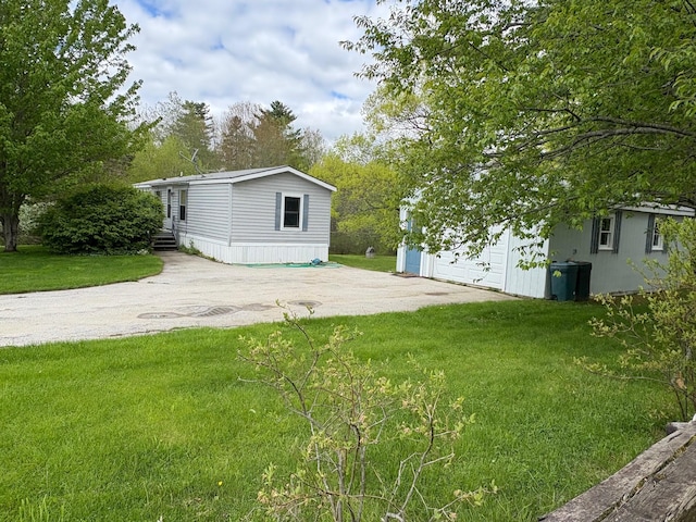 1236 Waldo Station Rd, Waldo, ME 04915 - view of green lawn featuring an outdoor structure and driveway