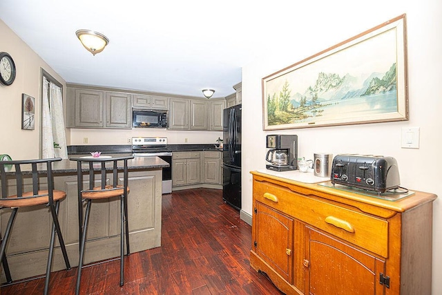 84 Little River Rd, Berwick, ME 03901 - kitchen with black appliances, dark wood-style flooring, a kitchen bar, and gray cabinets