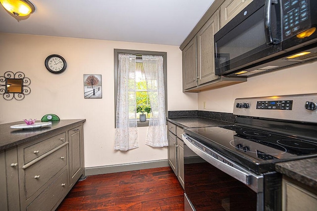 84 Little River Rd, Berwick, ME 03901 - kitchen with stainless steel electric range, black microwave, dark countertops, and dark wood finished floors