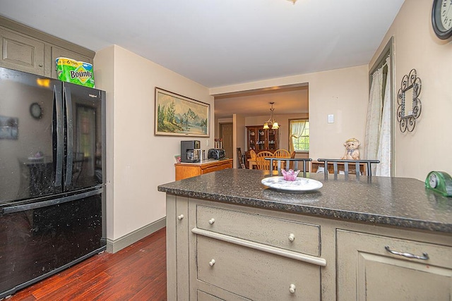84 Little River Rd, Berwick, ME 03901 - kitchen with freestanding refrigerator, dark wood finished floors, dark countertops, a chandelier, and baseboards