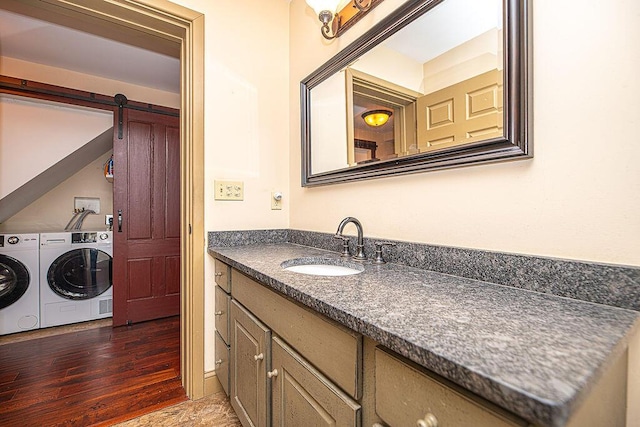 84 Little River Rd, Berwick, ME 03901 - bathroom with washing machine and dryer, vanity, and wood finished floors