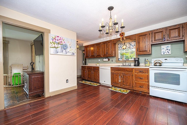 84 Little River Rd, Berwick, ME 03901 - kitchen featuring white appliances, light countertops, a chandelier, dark wood-style flooring, and a textured ceiling