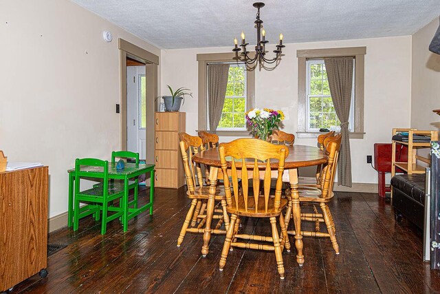 84 Little River Rd, Berwick, ME 03901 - dining space with a chandelier, wood-type flooring, a textured ceiling, and baseboards