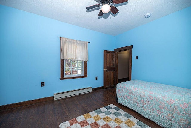 84 Little River Rd, Berwick, ME 03901 - bedroom with a baseboard radiator, wood finished floors, a textured ceiling, baseboards, and a ceiling fan
