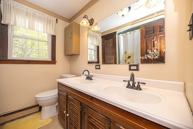 84 Little River Rd, Berwick, ME 03901 - bathroom featuring baseboard heating, ornamental molding, toilet, double vanity, and plenty of natural light