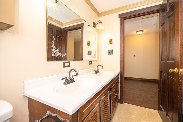 84 Little River Rd, Berwick, ME 03901 - bathroom featuring double vanity, toilet, crown molding, and baseboards