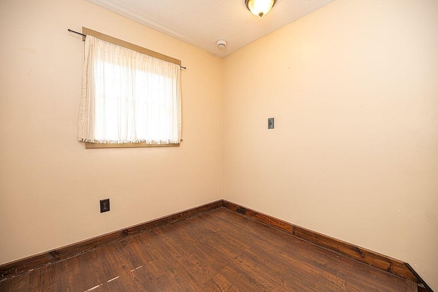 84 Little River Rd, Berwick, ME 03901 - unfurnished room with dark wood-style floors, baseboards, a textured ceiling, and a smoke detector