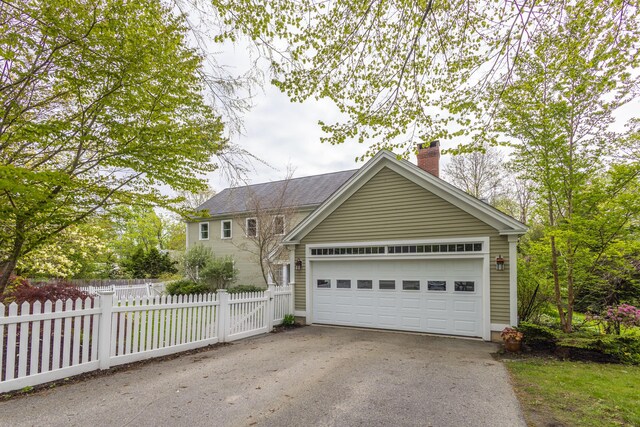 17 Spruce St, Rockport, ME 04856 - traditional-style home with a chimney, a garage, and driveway