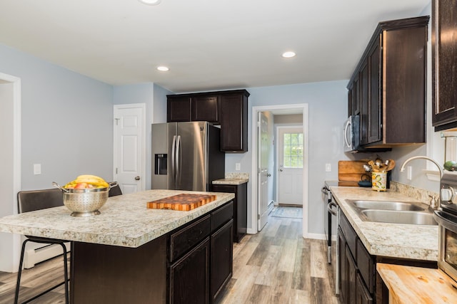 80 Hubbard Rd, Berwick, ME 03901 - kitchen featuring stainless steel appliances, a sink, light countertops, dark brown cabinetry, and recessed lighting