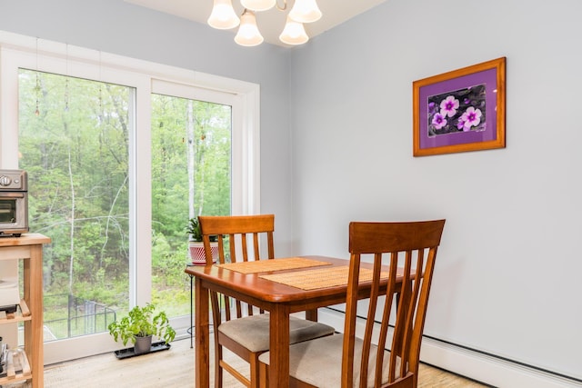 80 Hubbard Rd, Berwick, ME 03901 - dining space with a chandelier, wood finished floors, and healthy amount of natural light