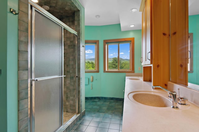 2222 Main Rd, Chatham, NH 03813 - full bathroom featuring a stall shower, double vanity, tile patterned flooring, and baseboards