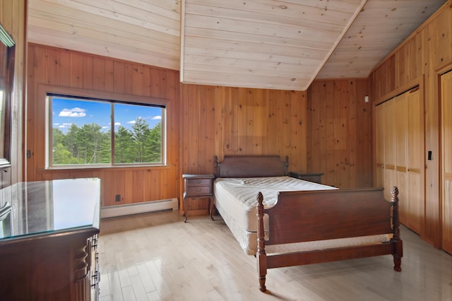 2222 Main Rd, Chatham, NH 03813 - bedroom featuring baseboard heating, wooden walls, wood ceiling, light wood-style flooring, and lofted ceiling