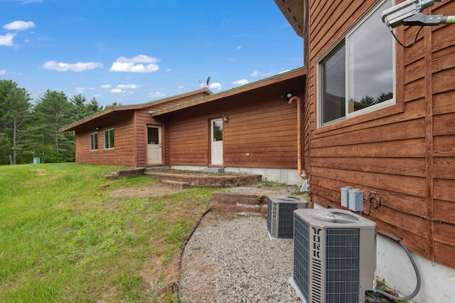 2222 Main Rd, Chatham, NH 03813 - back of property featuring central air condition unit and a yard