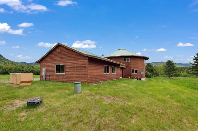 2222 Main Rd, Chatham, NH 03813 - view of side of property with a yard and a mountain view