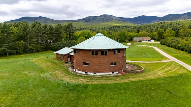 2222 Main Rd, Chatham, NH 03813 - view of home's exterior featuring a forest view, a mountain view, a yard, and dirt driveway