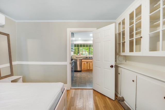 4 University Pl, Orono, ME 04473 - unfurnished bedroom featuring light wood finished floors, ornamental molding, and a sink